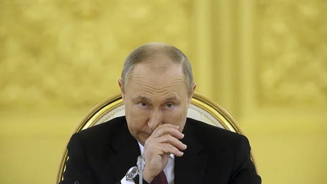 путін